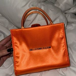 END SYSTEM RACISM. BRANDON Blackwood